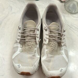 Cream and white on cloud running shoes